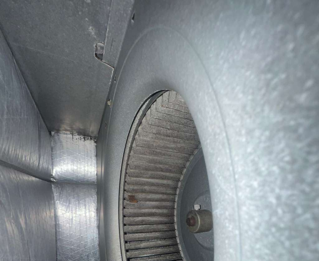Centrifugal blower fan inside galvanized steel ductwork being cleaned in Hillsborough County FL