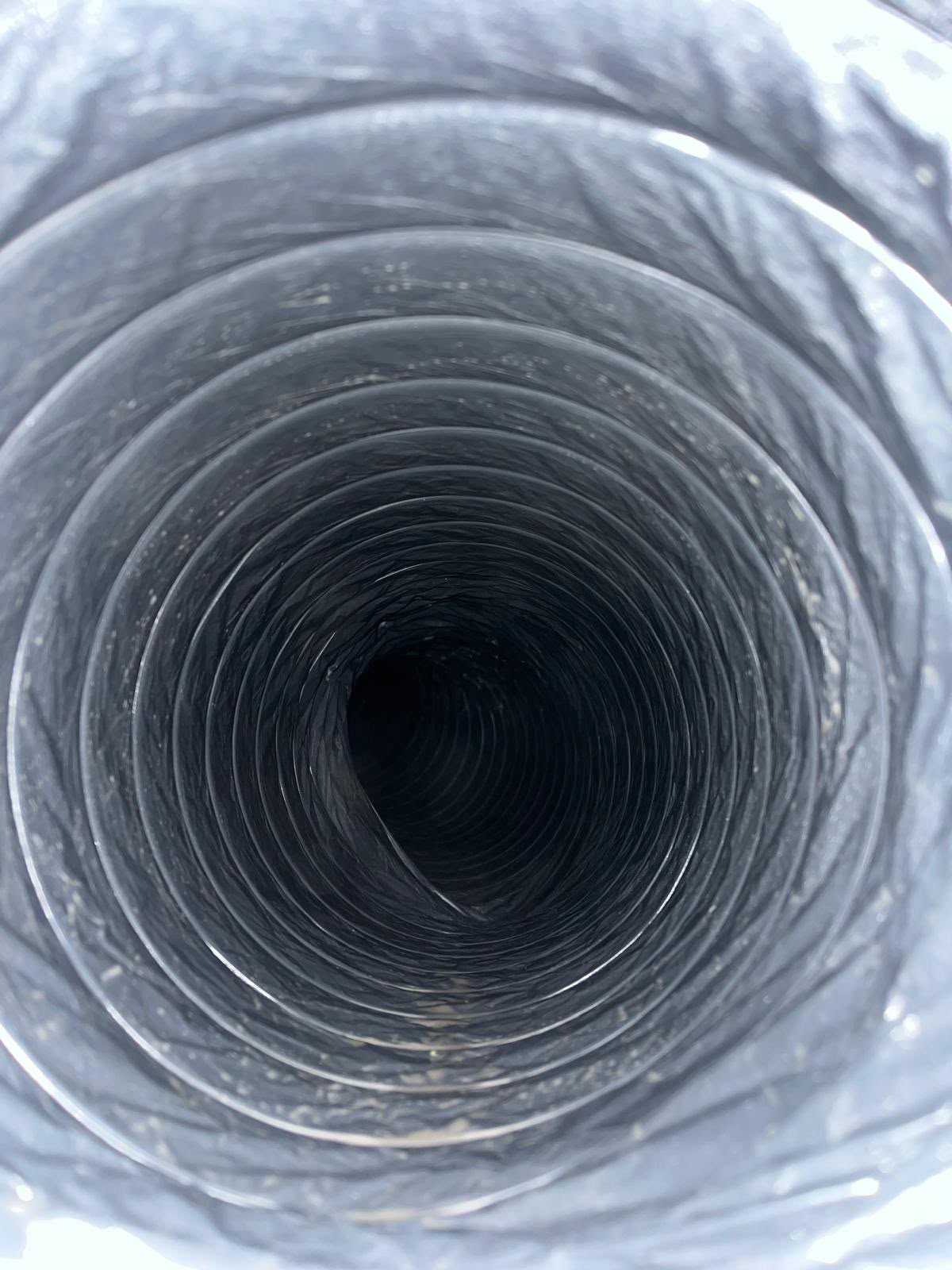 Dirty flexible air duct before professional air duct cleaning